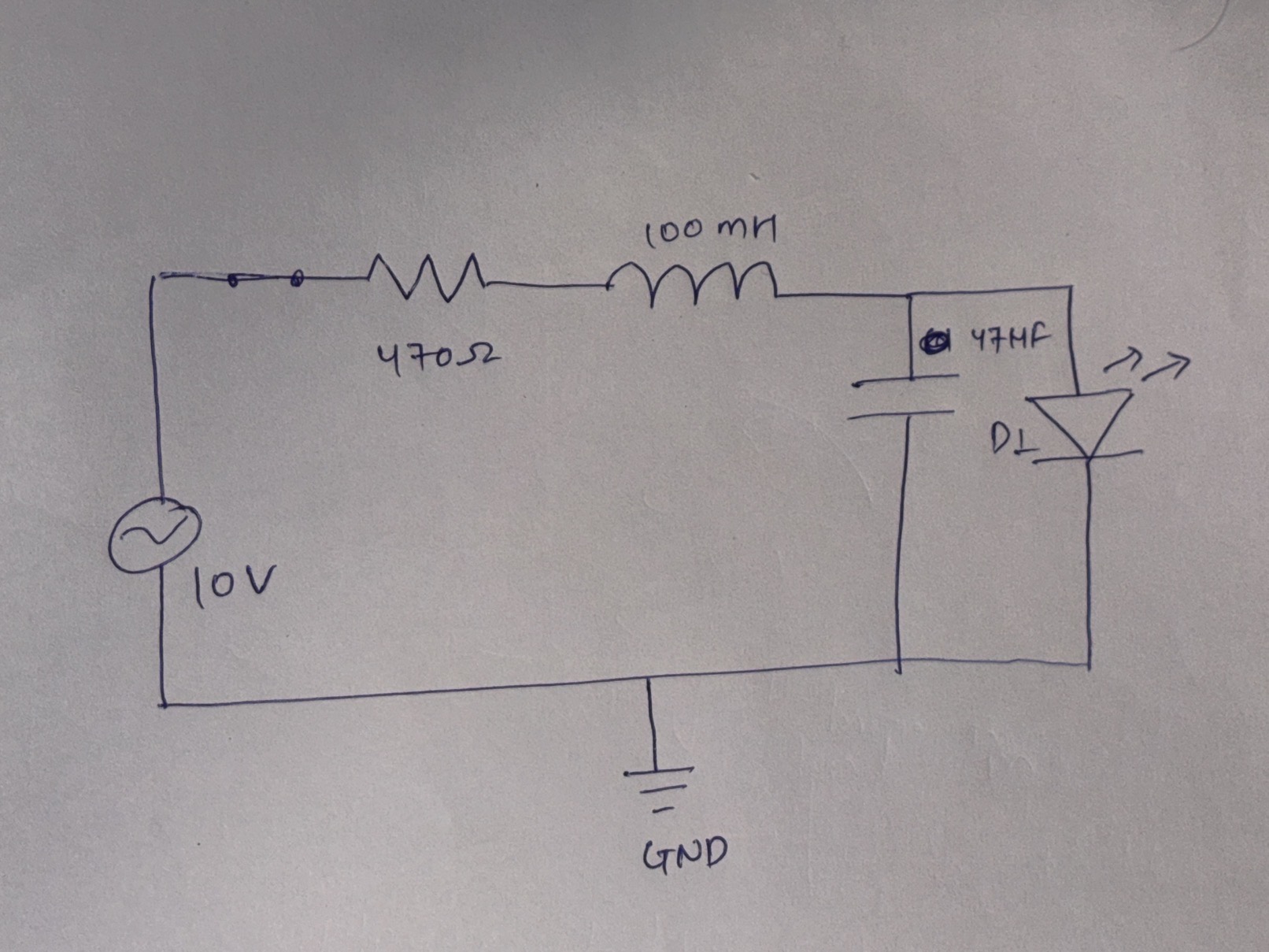 Hand-drawn replica of the RLC bench circuit, ballpoint on paper